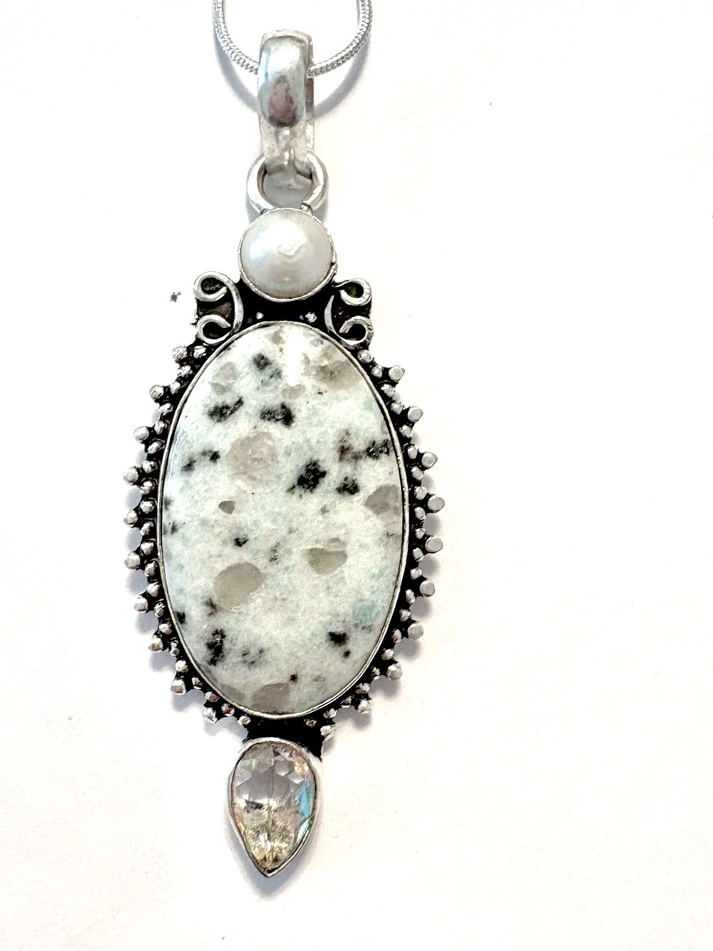 925 marked, kiwi Jasper,  White Topaz and Pearl pendant on a silver chain.